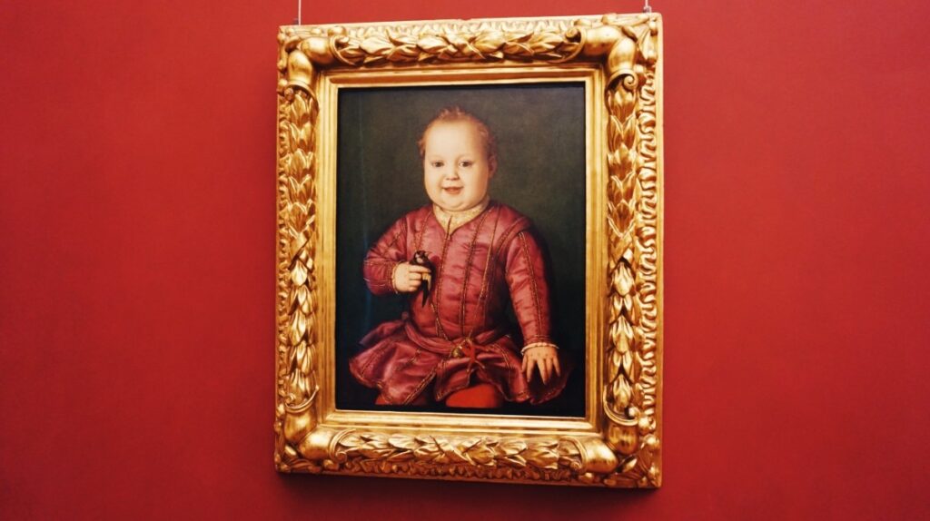 A painting with a baby in Uffizi Gallery